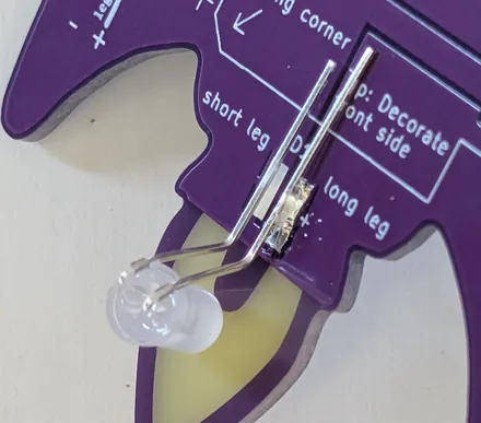 Close-up of an LED partially soldered to the PCB