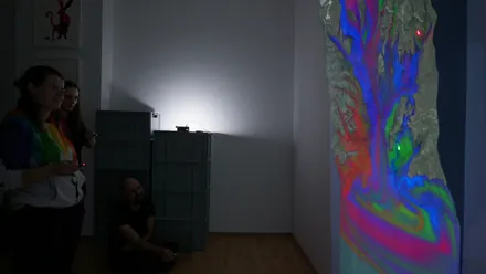 Multiple visitors interacting with the installation